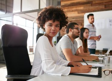 confident-businesswoman-sitting-at-a-business-PPDZBVF.jpg